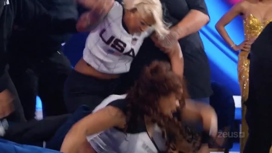 Close grappling and hair pulling between the two cast members