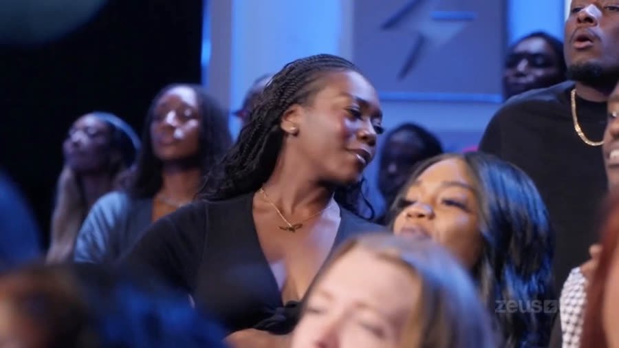 Live studio audience reacting with shock to the altercation